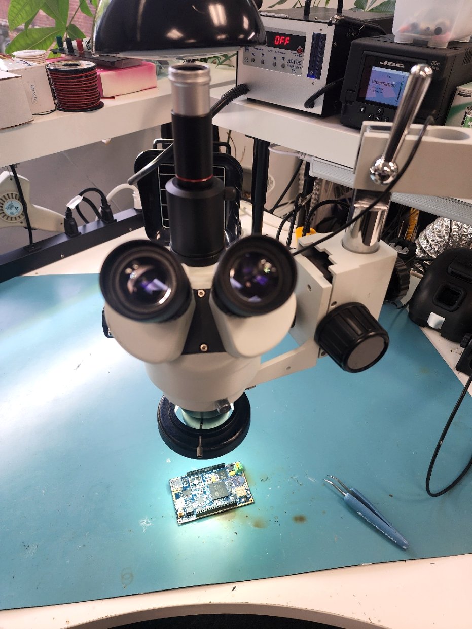 A board under the stereo microscope for solder-joint inspection at ARG