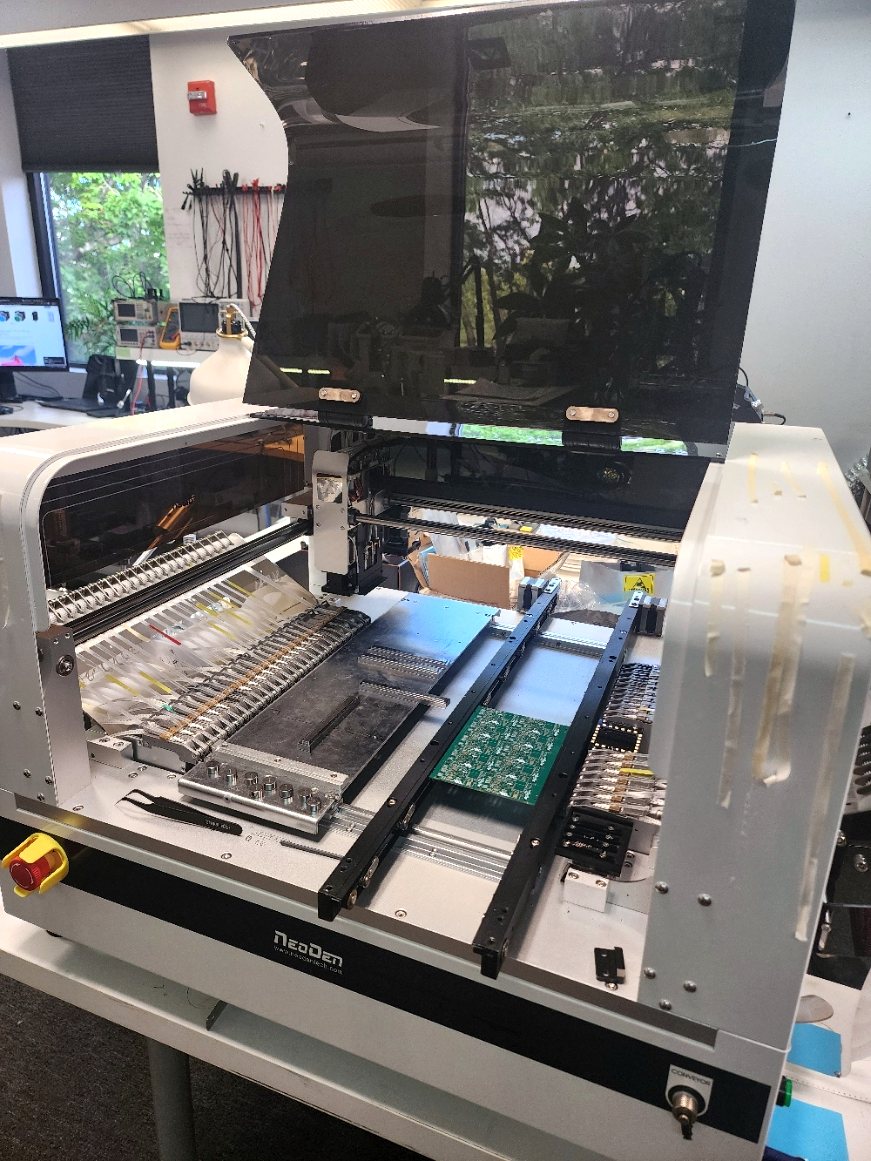 ARG's in-house pick-and-place SMT line loading a PCB panel