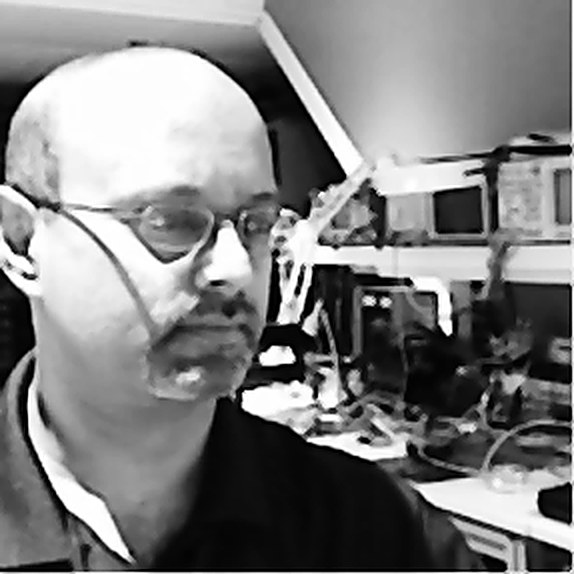 Madhu Annapragada, founder of Automation Research Group, at the workbench